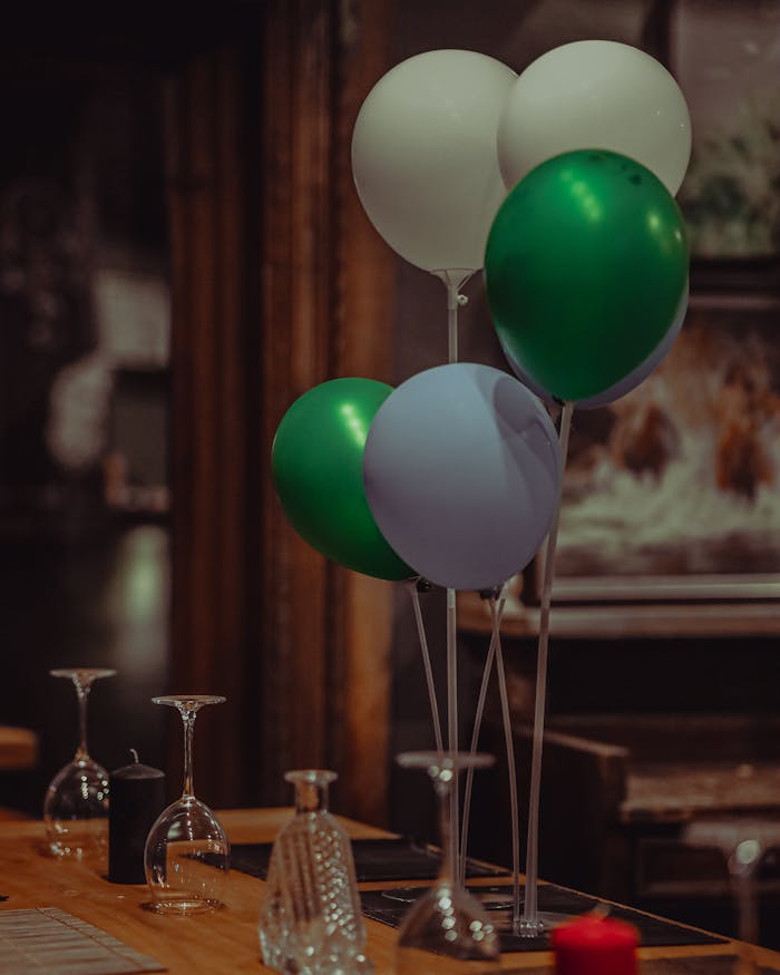 A vibrant bouquet of balloons adds a festive touch to a dining table setting.