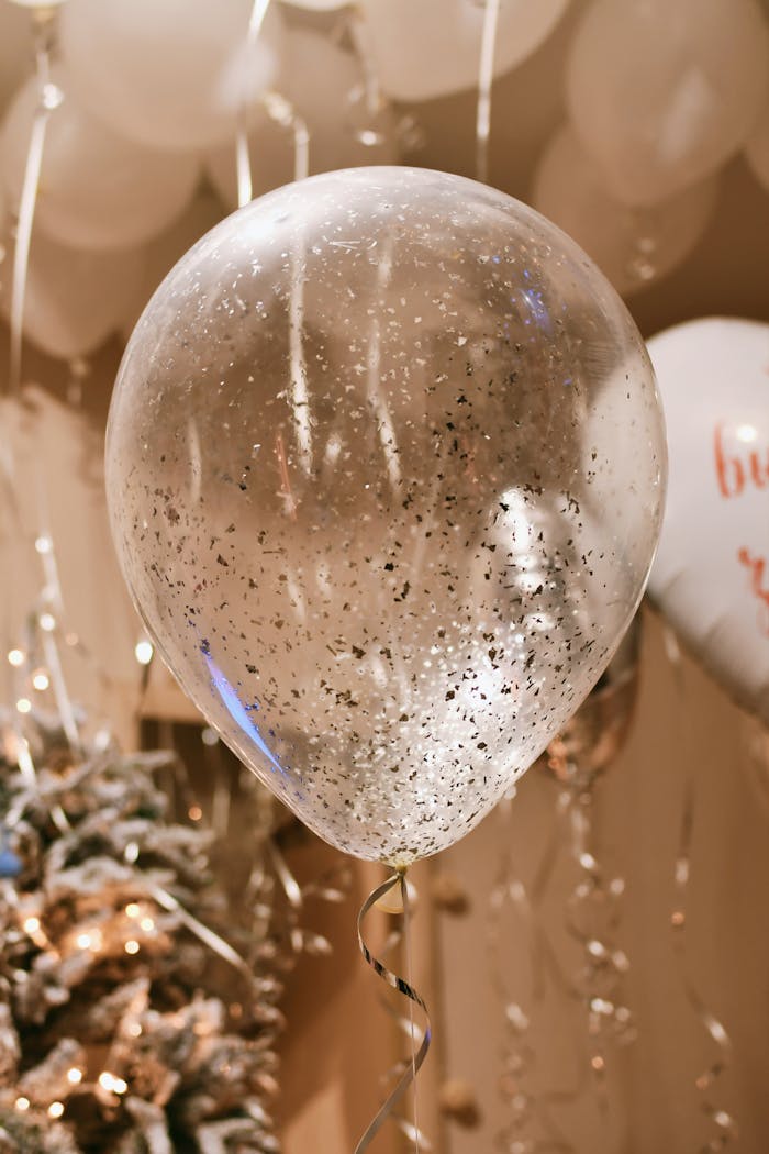 A glittery balloon setup perfect for festive celebrations and parties indoors.